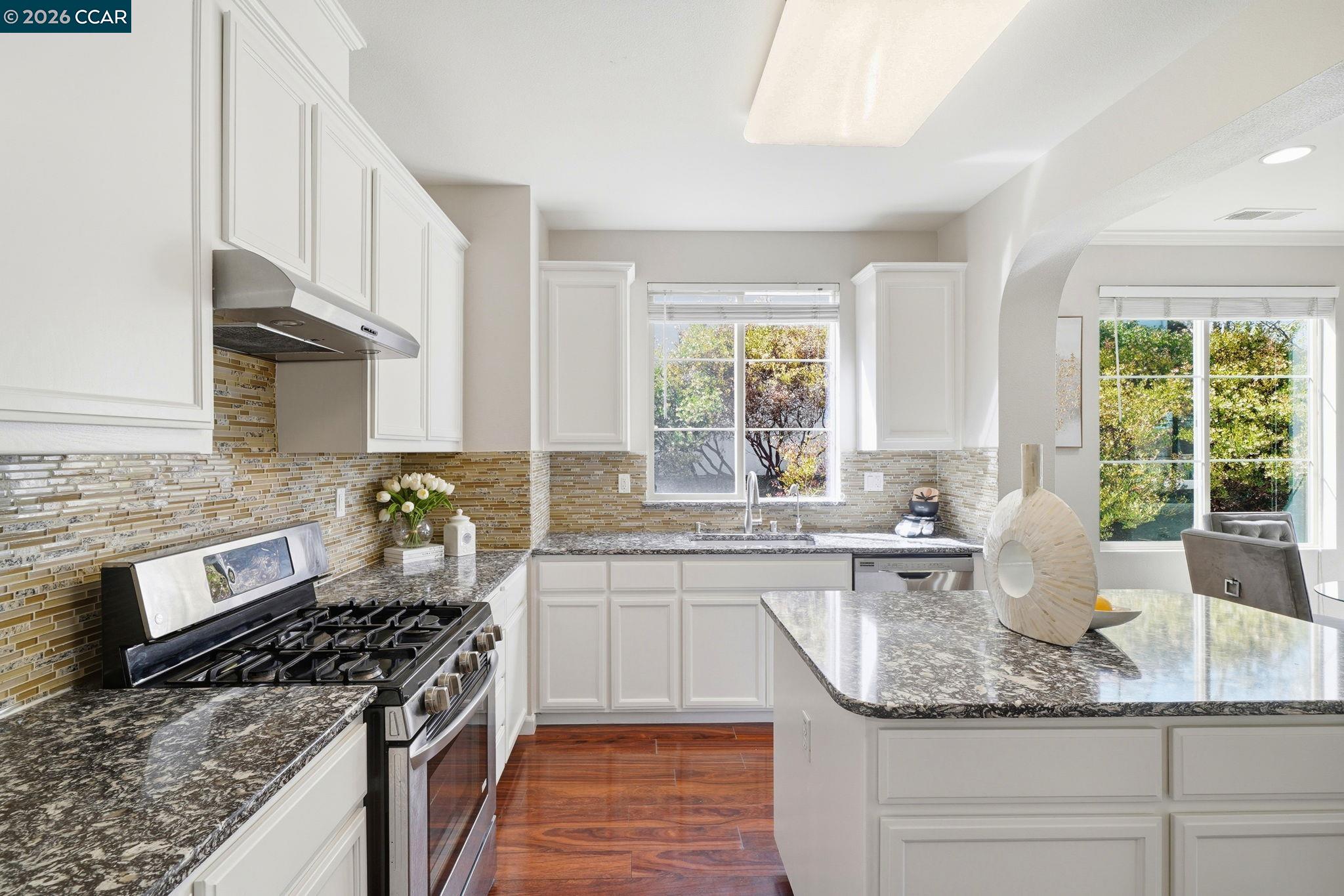3217 Amaryllis Circle San Ramon, CA 94582 - Photo 15 of 48 a kitchen with stainless steel appliances granite countertop a stove a sink and a granite counter tops
