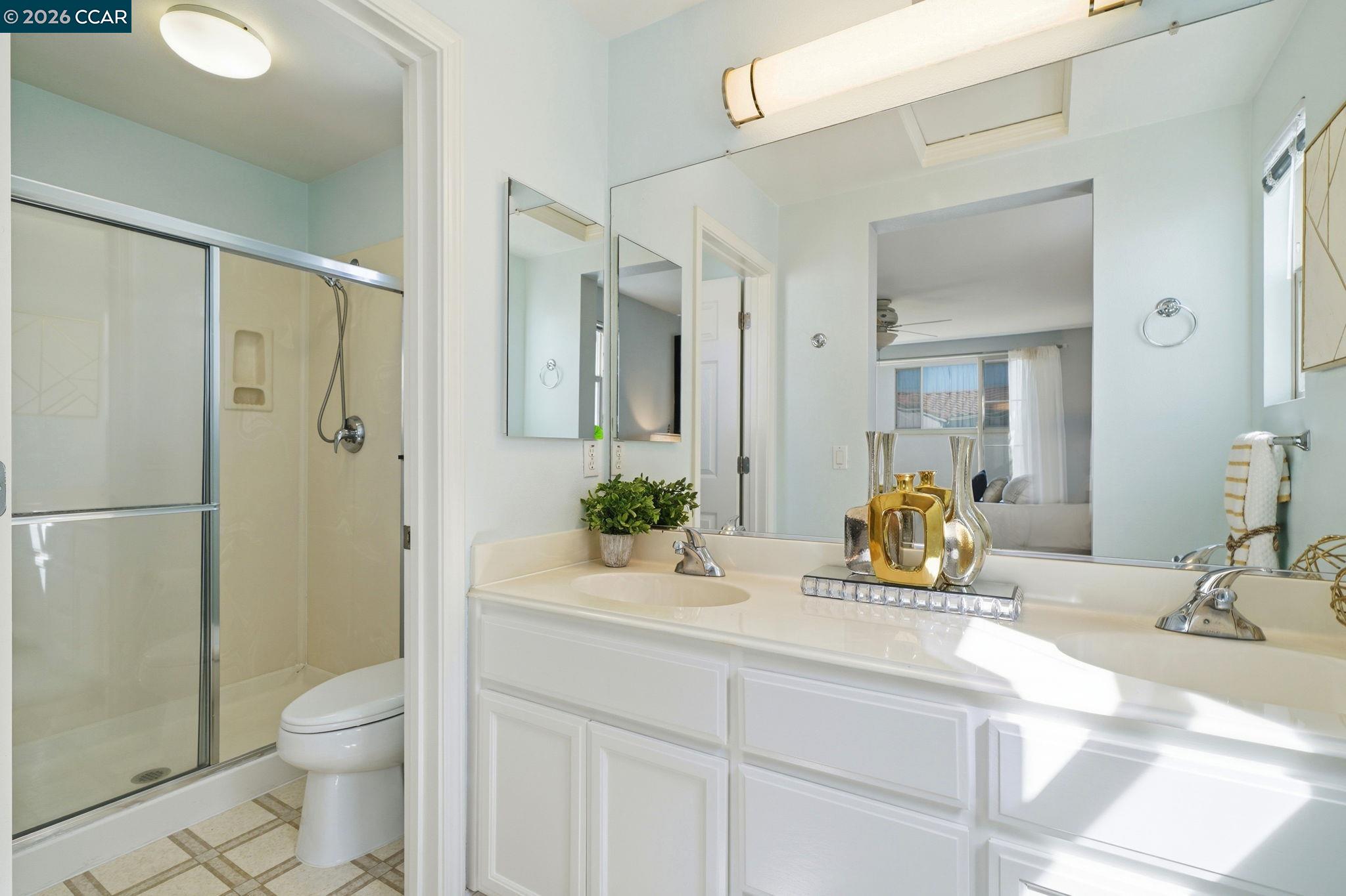 3217 Amaryllis Circle San Ramon, CA 94582 - Photo 23 of 48 a bathroom with a toilet a sink and shower
