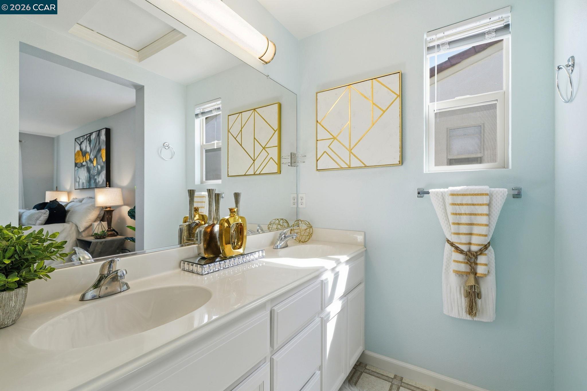 3217 Amaryllis Circle San Ramon, CA 94582 - Photo 24 of 48 a bathroom with double vanity sink and a mirror