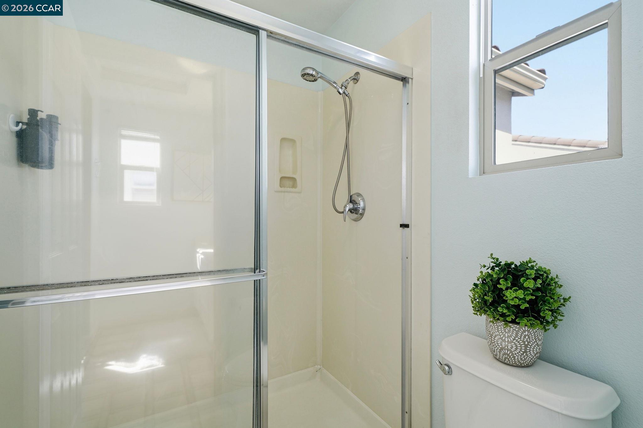 3217 Amaryllis Circle San Ramon, CA 94582 - Photo 25 of 48 a bathroom with a shower a toilet and a sink