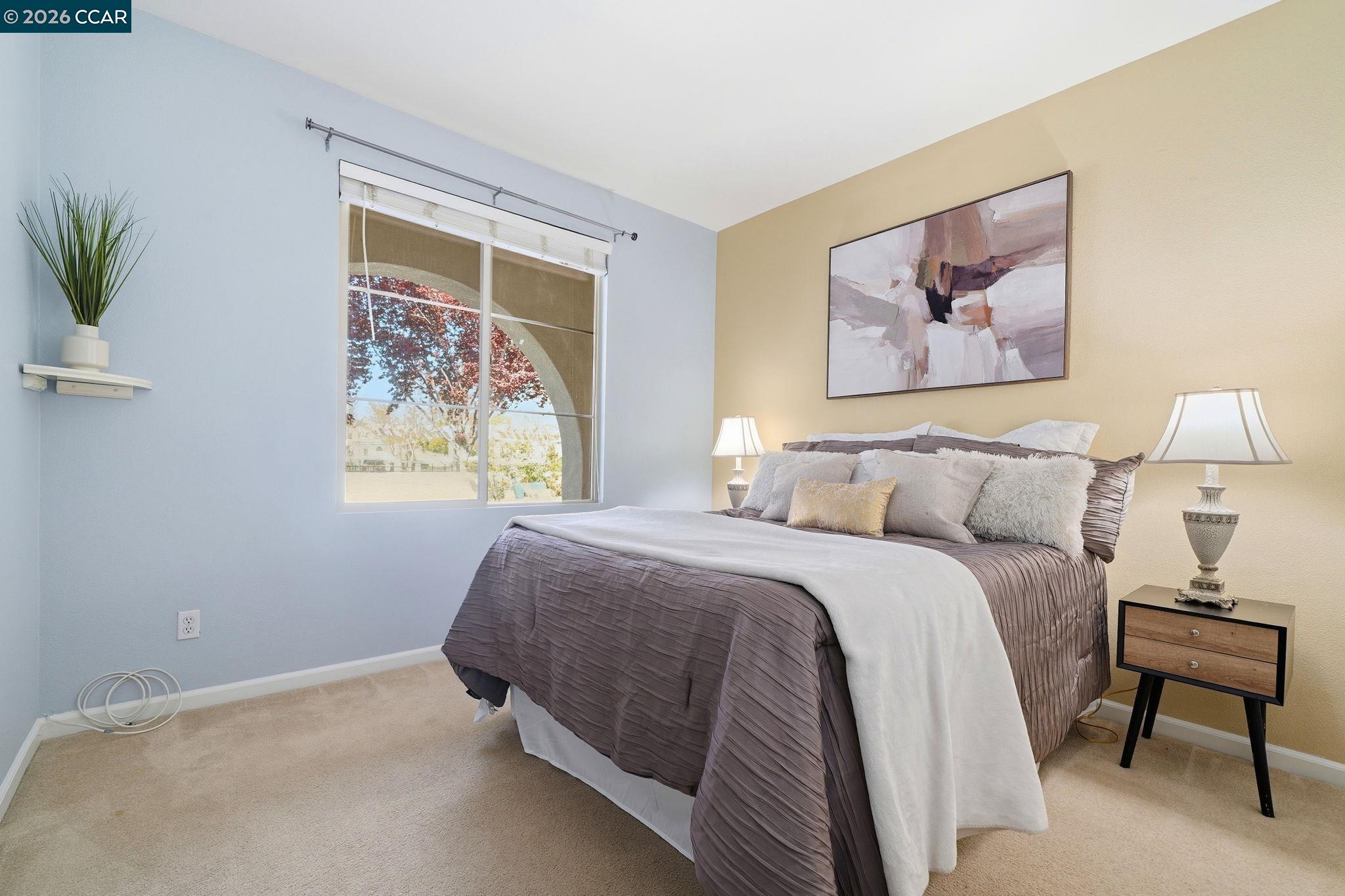 3217 Amaryllis Circle San Ramon, CA 94582 - Photo 26 of 48 a bedroom with a bed and a painting on the wall