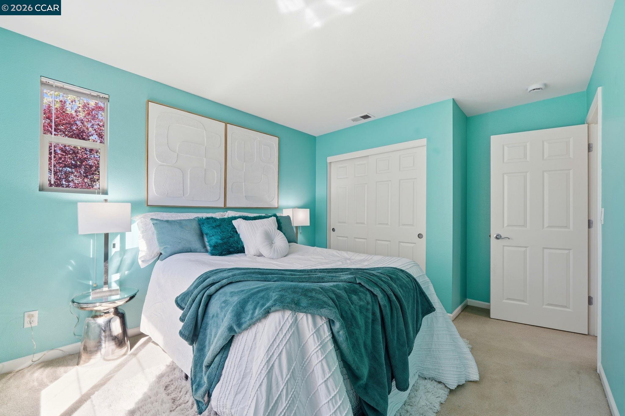 3217 Amaryllis Circle San Ramon, CA 94582 - Photo 32 of 48 a bedroom with a bed and a lamp