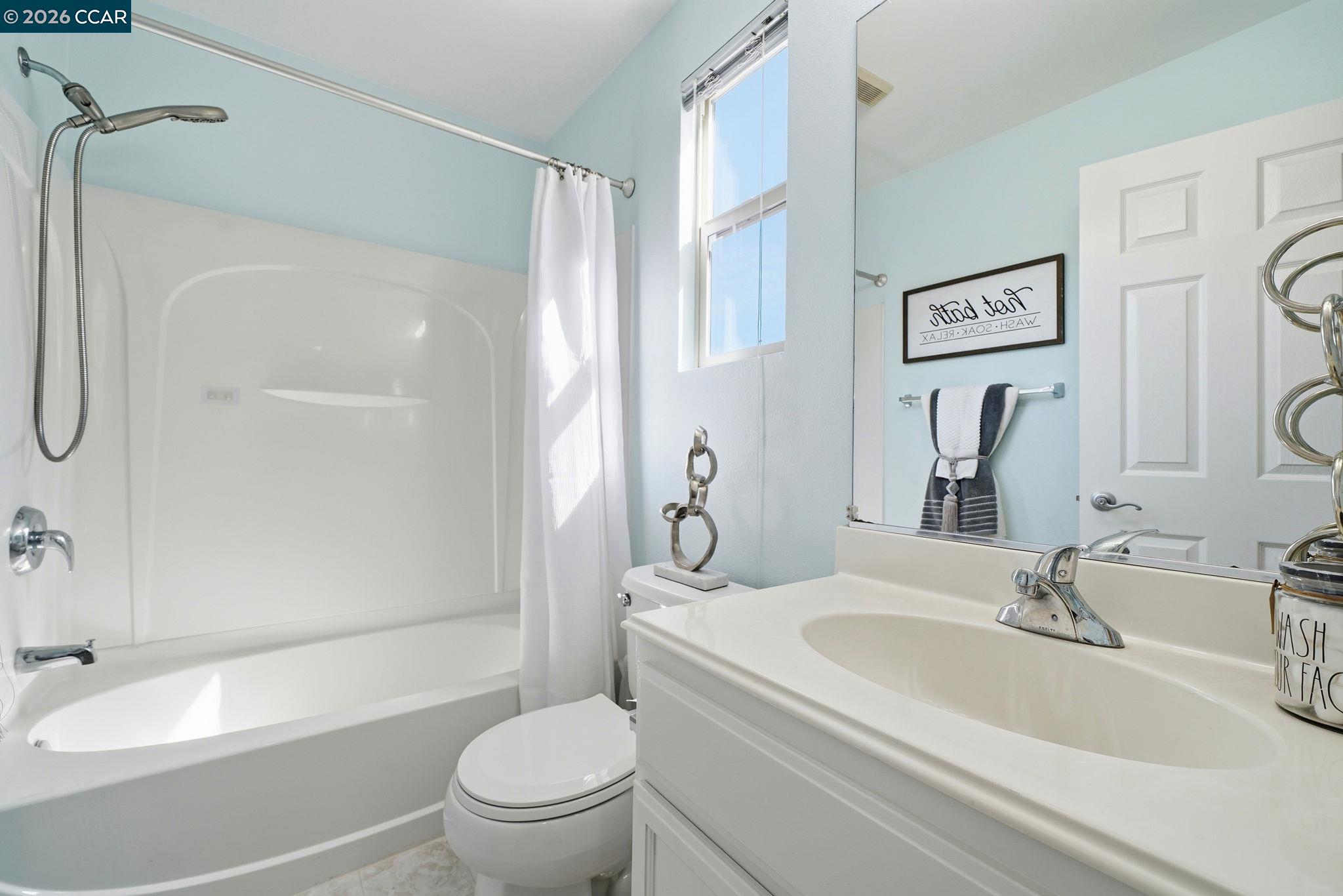 3217 Amaryllis Circle San Ramon, CA 94582 - Photo 34 of 48 a bathroom with a granite countertop sink toilet and shower