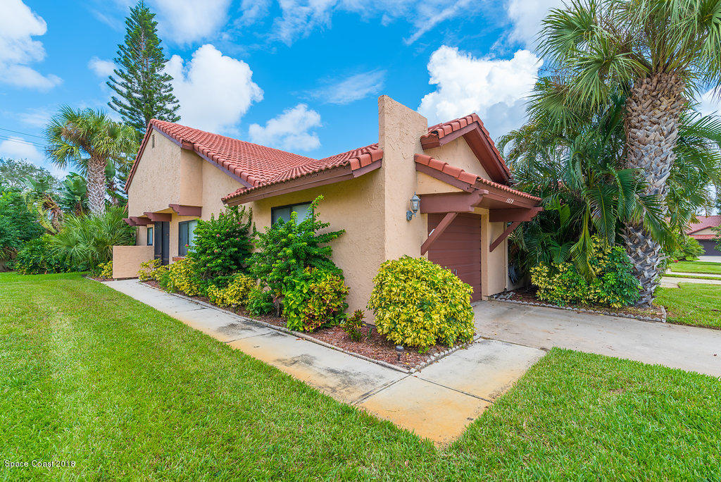 1679 Avery Road Northeast Palm Bay, FL 32905 - Photo 3 of 30 a front view of a house with garden