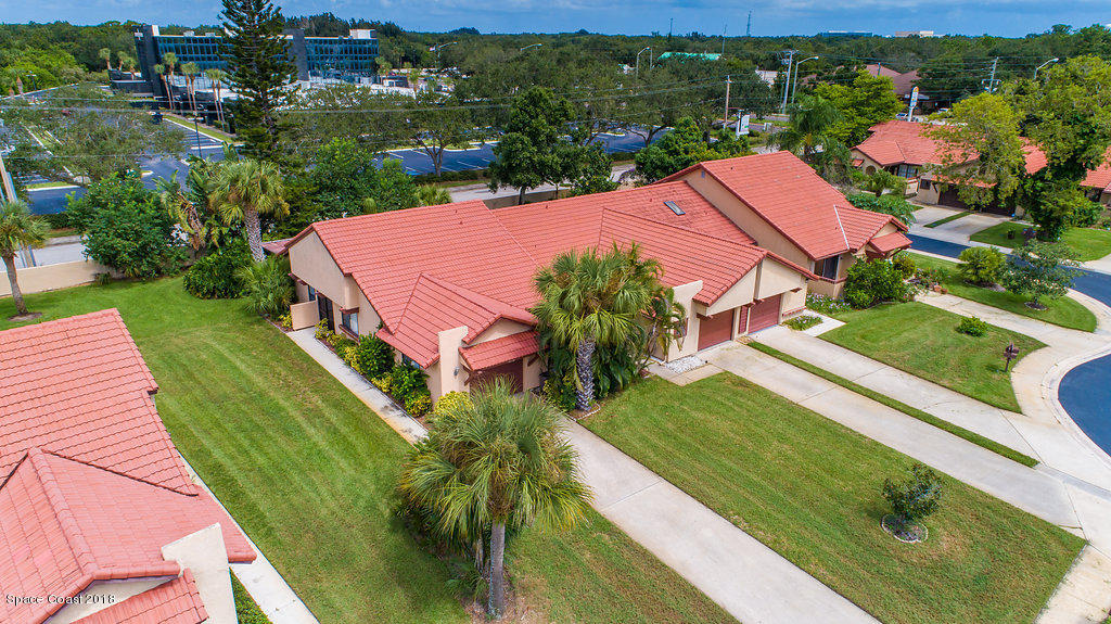 1679 Avery Road Northeast Palm Bay, FL 32905 - Photo 5 of 30 an aerial view of a house with a garden