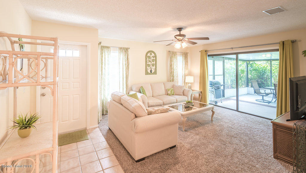 1679 Avery Road Northeast Palm Bay, FL 32905 - Photo 8 of 30 a living room with furniture and a large window
