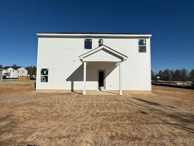 a house with trees in front of it