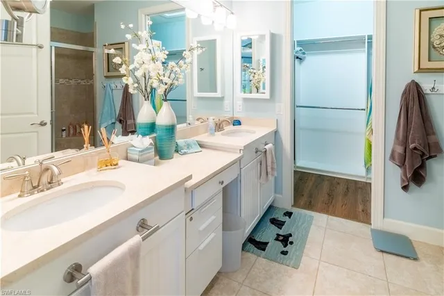 a bathroom with a shower and a sink