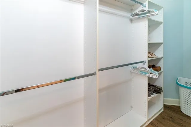 a bathroom with a granite countertop shower a toilet and a sink