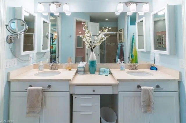 a view of a patio with table and chairs potted plants