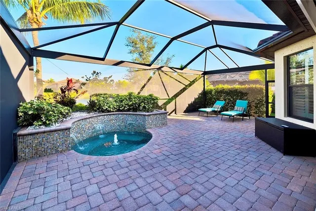 a view of a patio with furniture and a yard