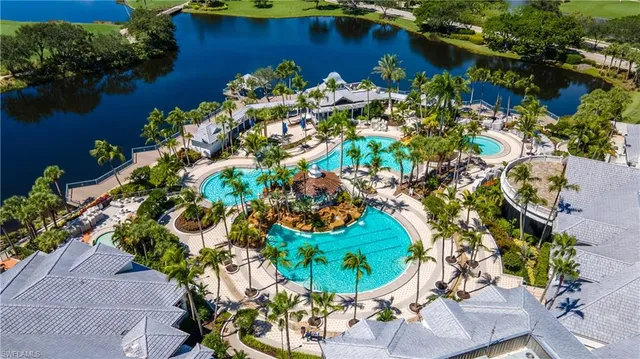 an aerial view of residential houses with outdoor space and street view