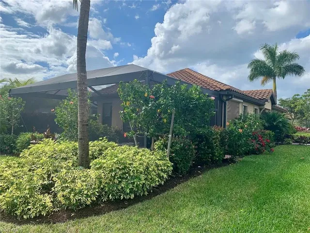 an aerial view of house with yard
