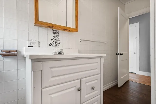 a bathroom with a sink and a mirror
