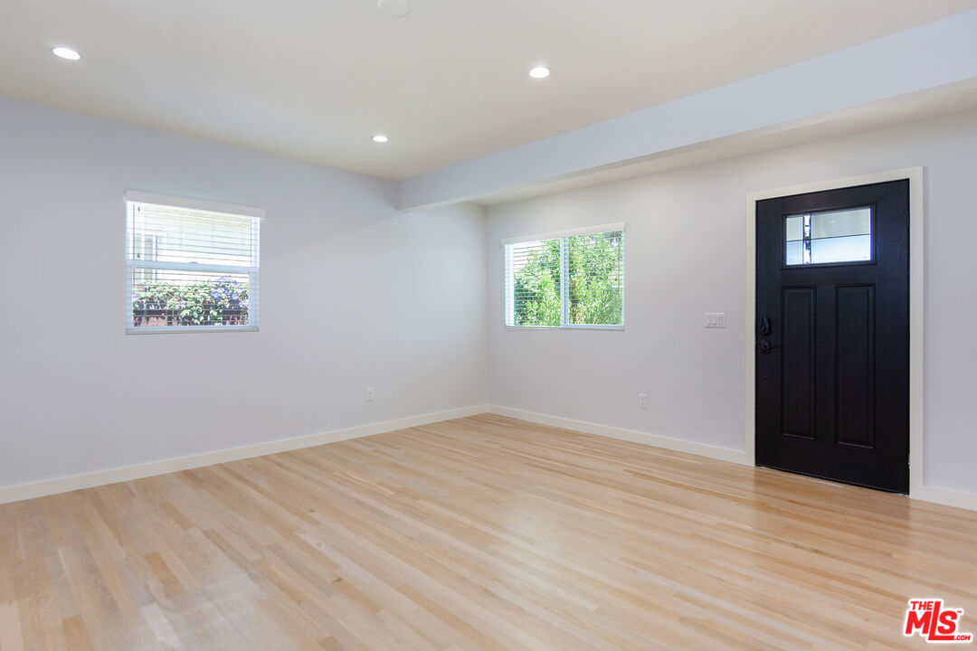 10845 Jefferson Boulevard Culver City, CA 90230 - Photo 12 of 48 a view of an empty room with wooden floor and a window