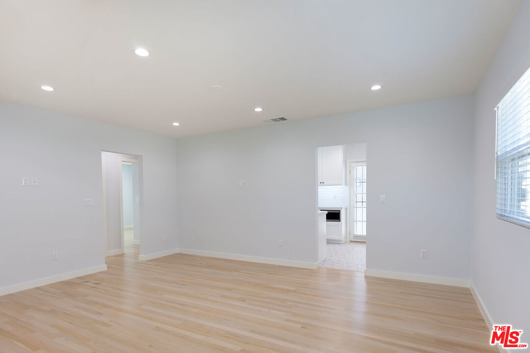 10845 Jefferson Boulevard Culver City, CA 90230 - Photo 15 of 48 a view of empty room with wooden floor and fan