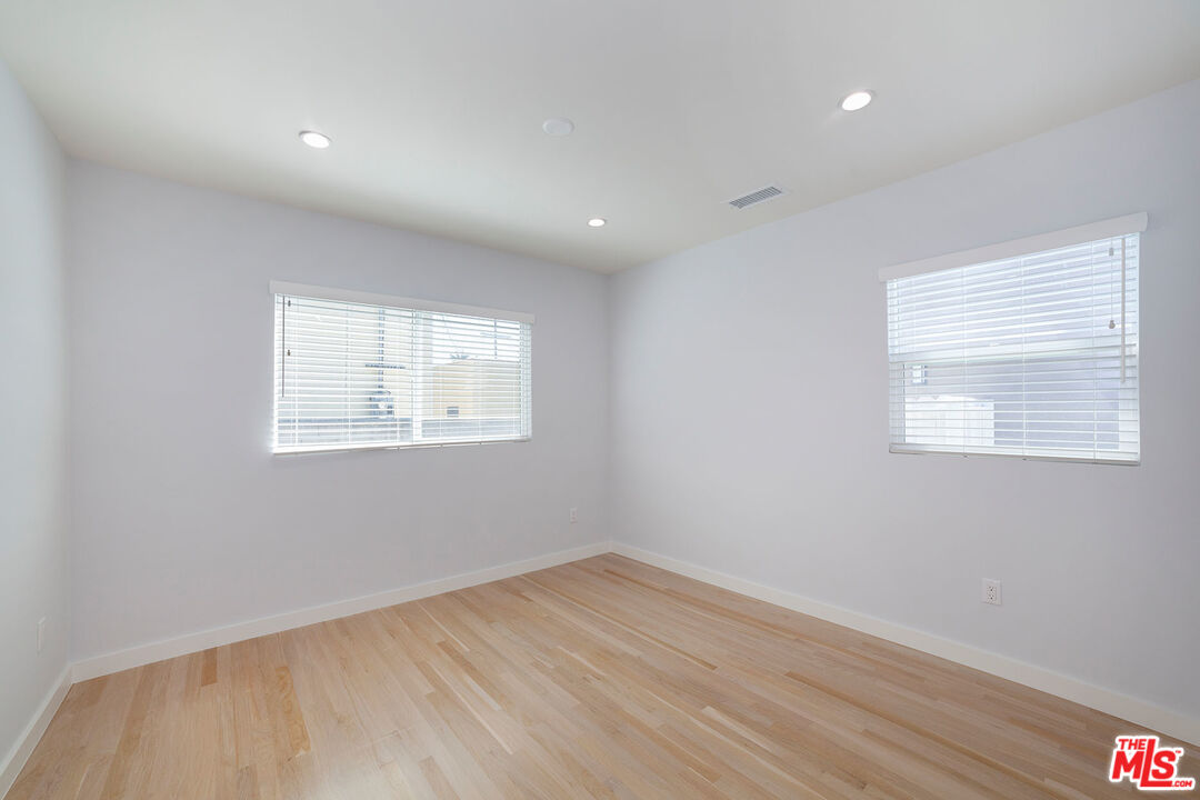 10845 Jefferson Boulevard Culver City, CA 90230 - Photo 26 of 48 an empty room with wooden floor and windows