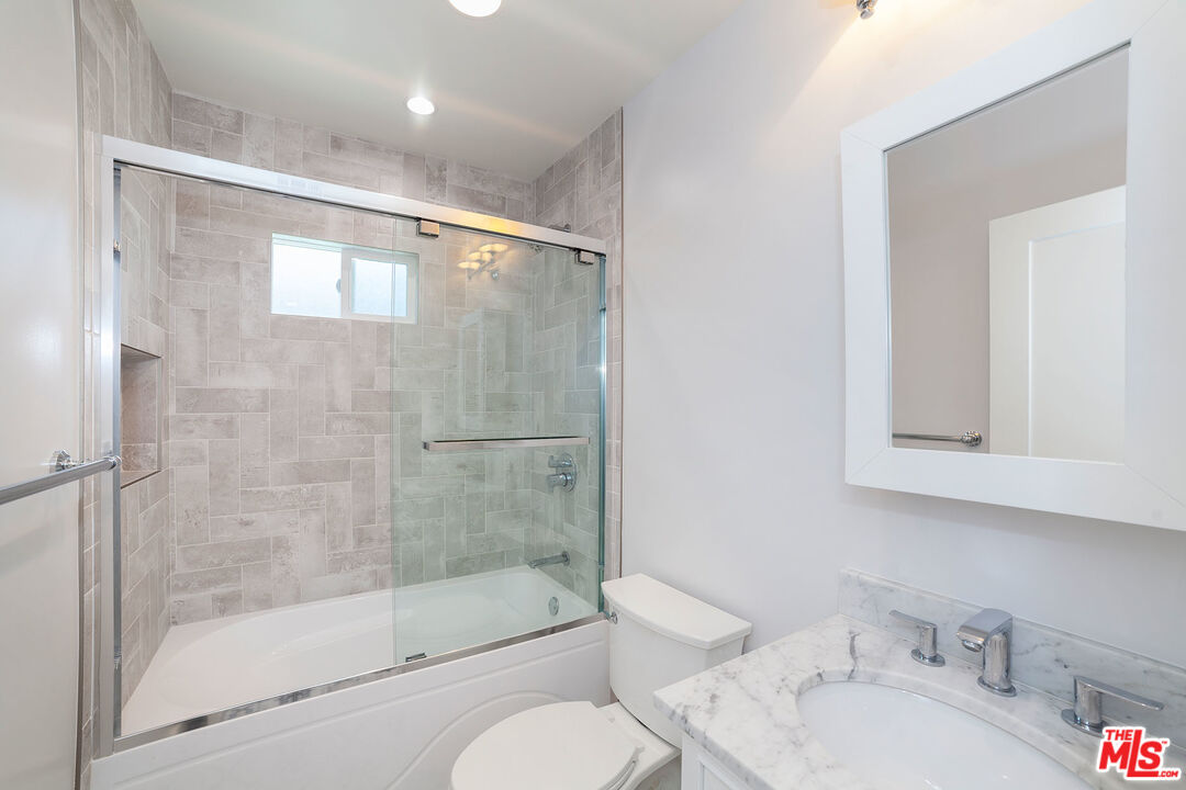 10845 Jefferson Boulevard Culver City, CA 90230 - Photo 27 of 48 a view of an empty room with wooden floor and a window