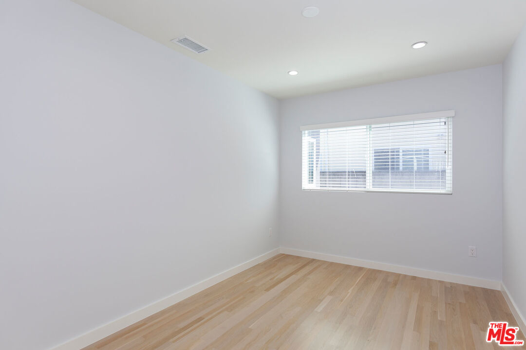 10845 Jefferson Boulevard Culver City, CA 90230 - Photo 30 of 48 an empty room with wooden floor and windows