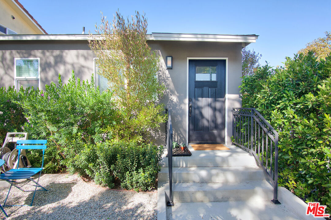 10845 Jefferson Boulevard Culver City, CA 90230 - Photo 44 of 48 a view of a house with potted plants and a large tree