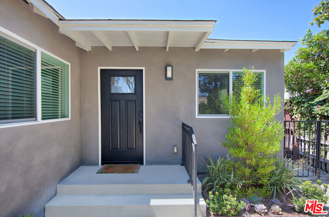 10845 Jefferson Boulevard Culver City, CA 90230 - Photo 6 of 48 a front view of a house with a yard