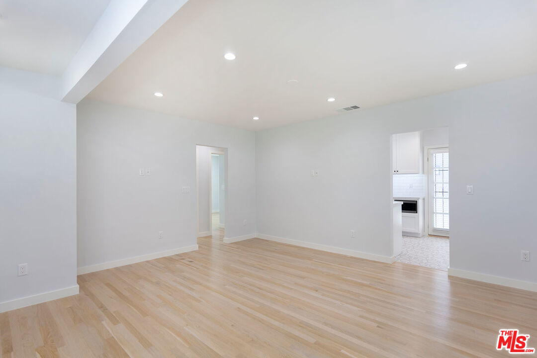 10845 Jefferson Boulevard Culver City, CA 90230 - Photo 10 of 48 an empty room with wooden floor and windows