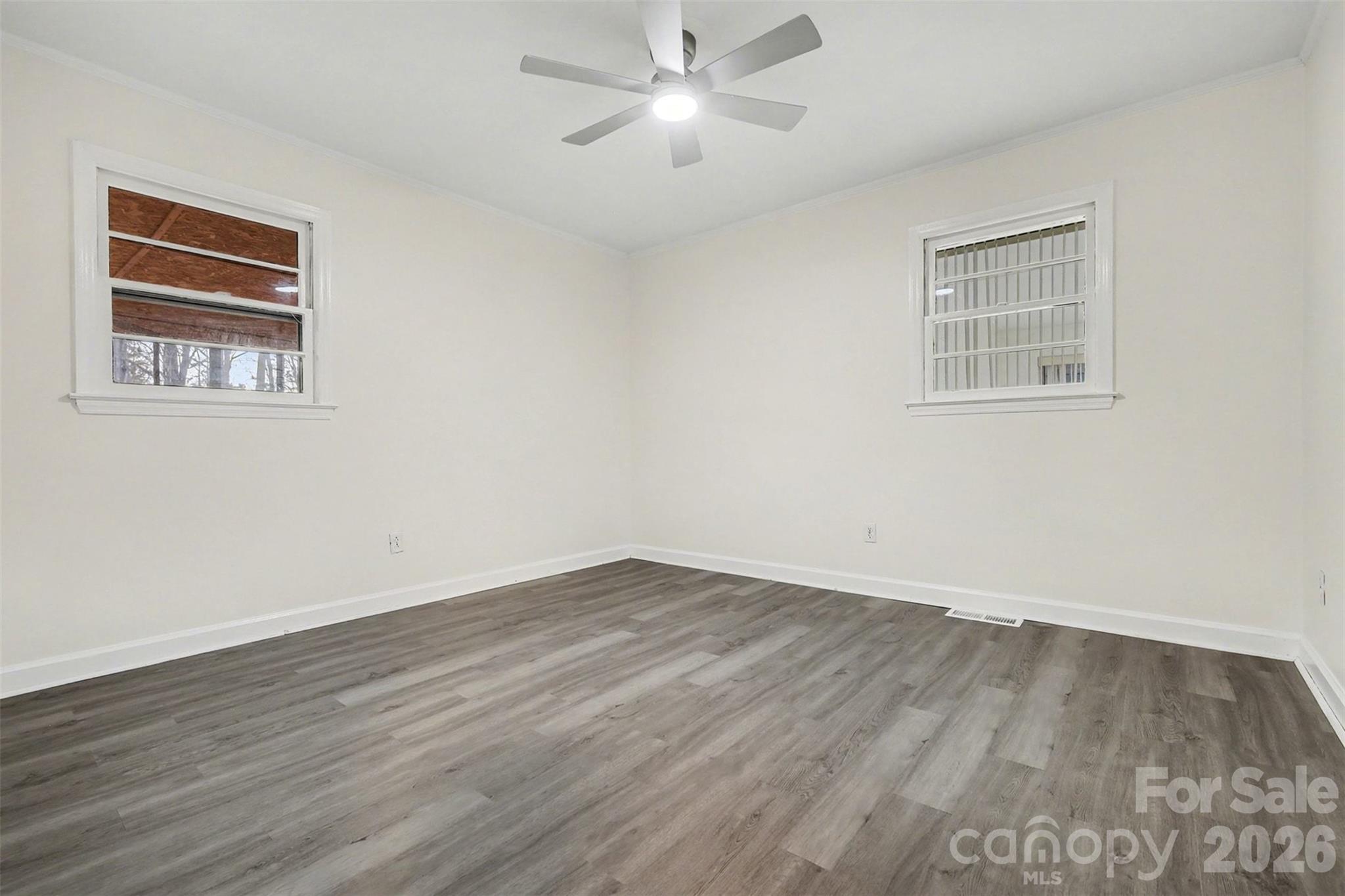 1343 Cedar Pines Lake Road Lancaster, SC 29720 - Photo 12 of 25 a view of an empty room with wooden floor and a window