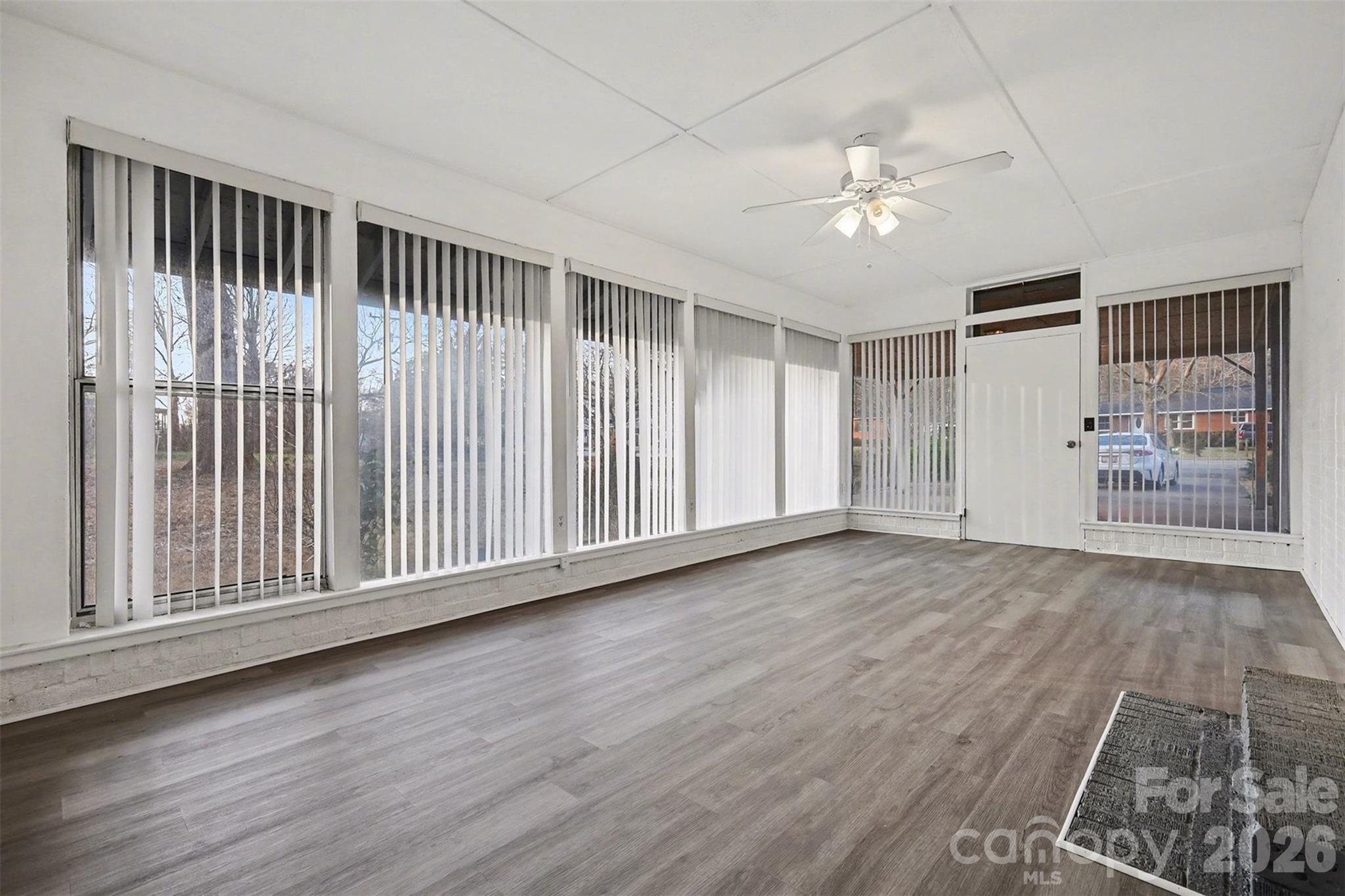 1343 Cedar Pines Lake Road Lancaster, SC 29720 - Photo 13 of 25 a view of an empty room with wooden floor and a window