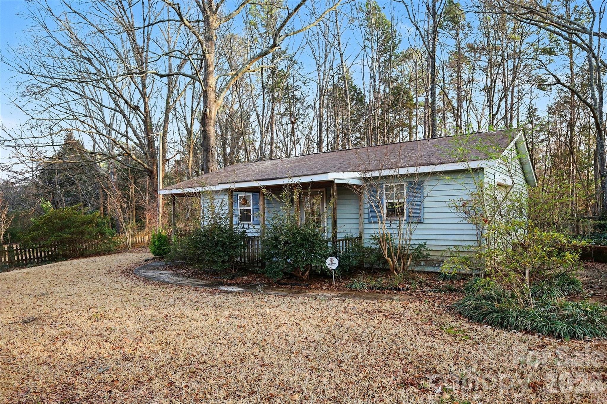 1343 Cedar Pines Lake Road Lancaster, SC 29720 - Photo 16 of 25 a front view of a house with garden