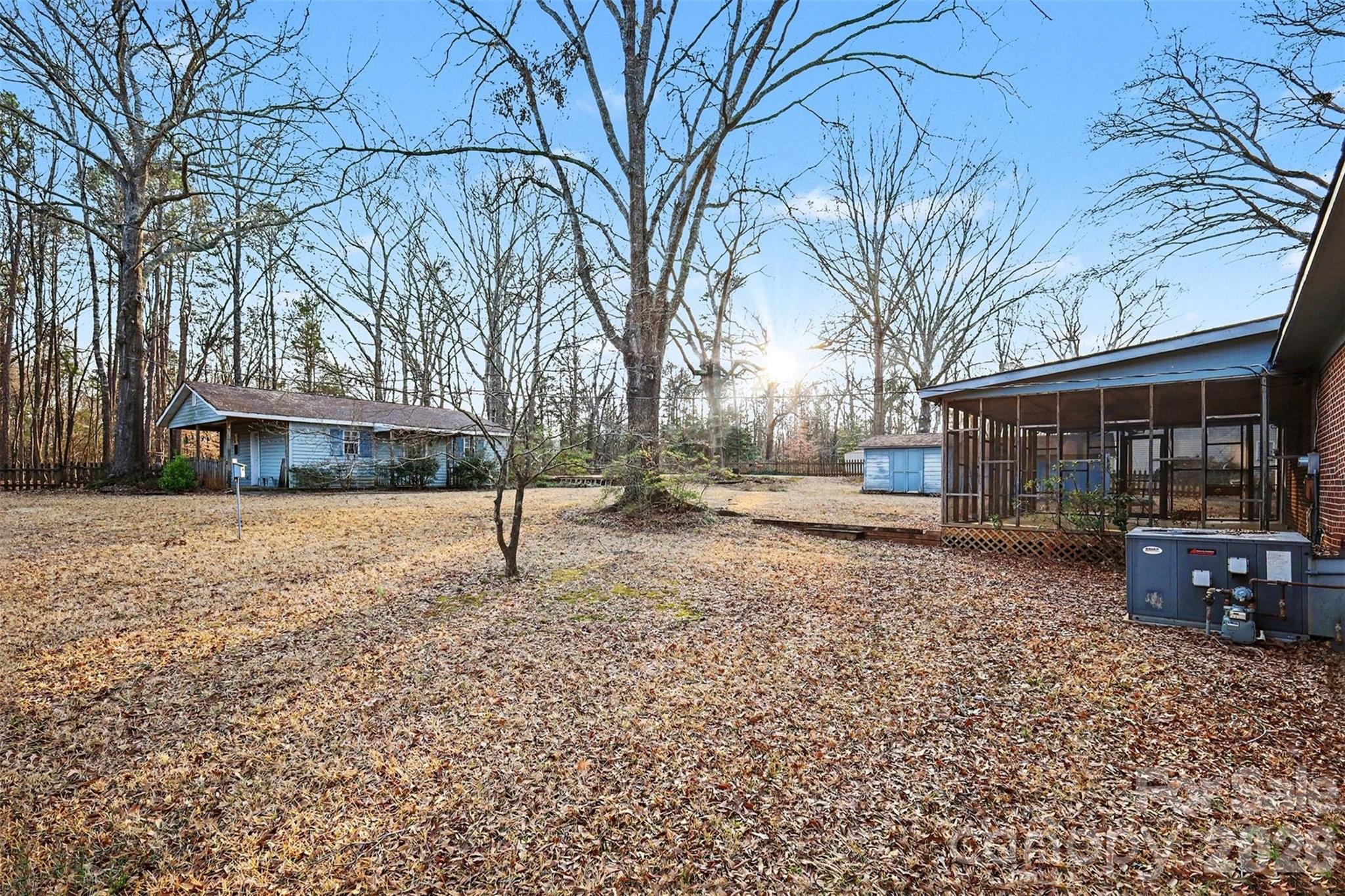 1343 Cedar Pines Lake Road Lancaster, SC 29720 - Photo 22 of 25 a backyard of a house with lots of green space