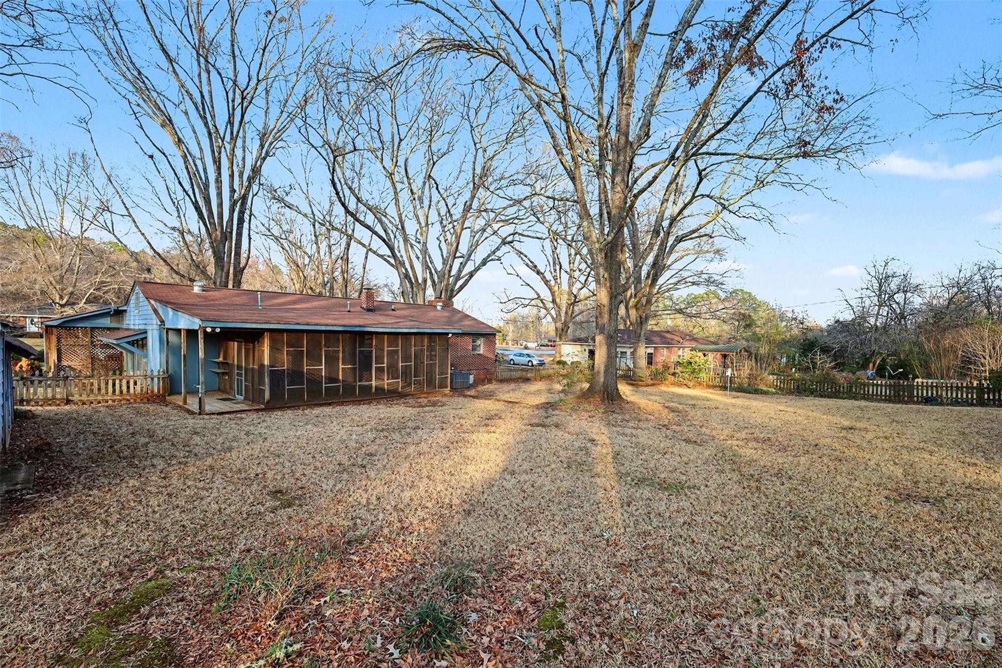 1343 Cedar Pines Lake Road Lancaster, SC 29720 - Photo 23 of 25 a view of a large house with a big yard and large tree
