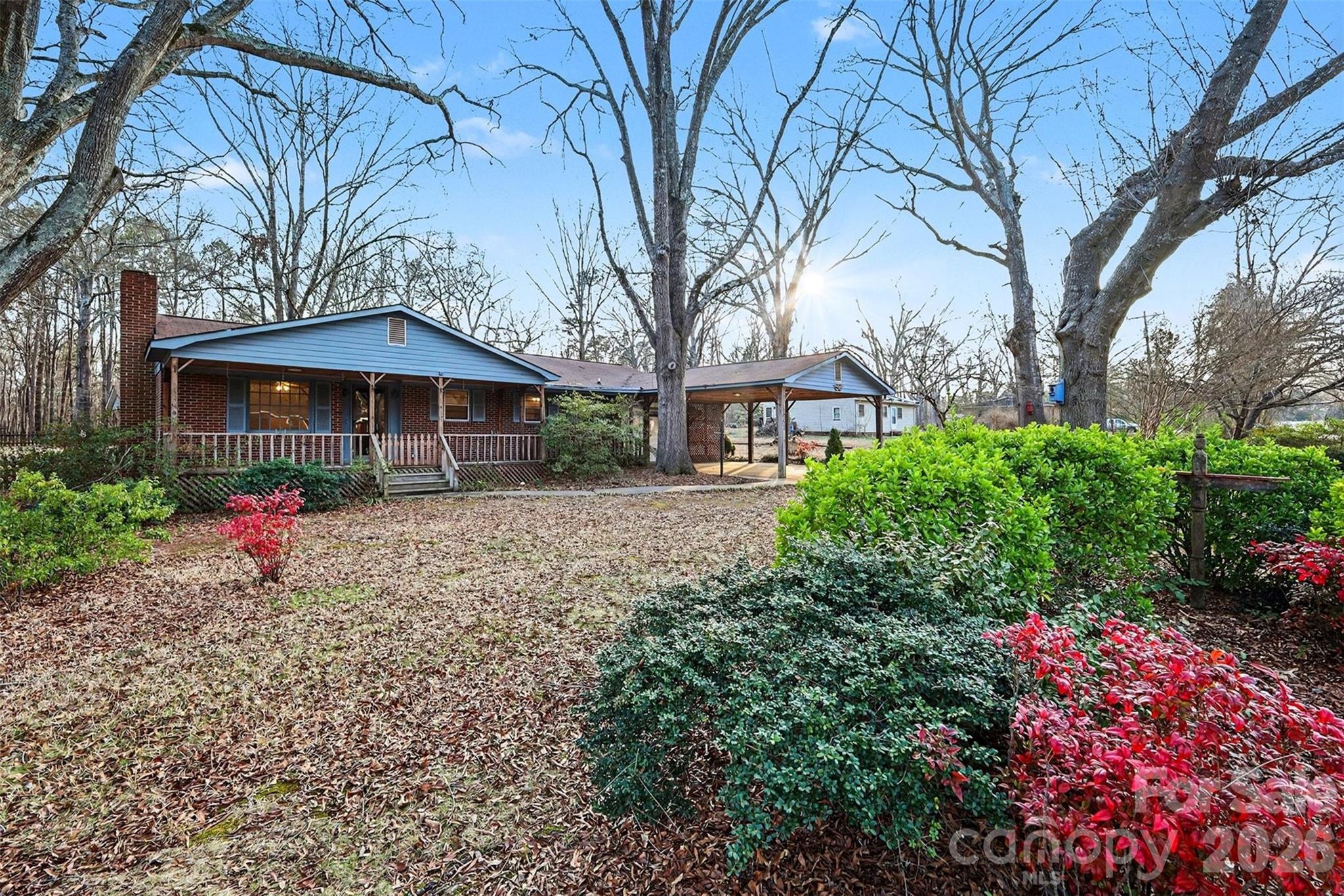 1343 Cedar Pines Lake Road Lancaster, SC 29720 - Photo 3 of 25 a front view of a house with garden