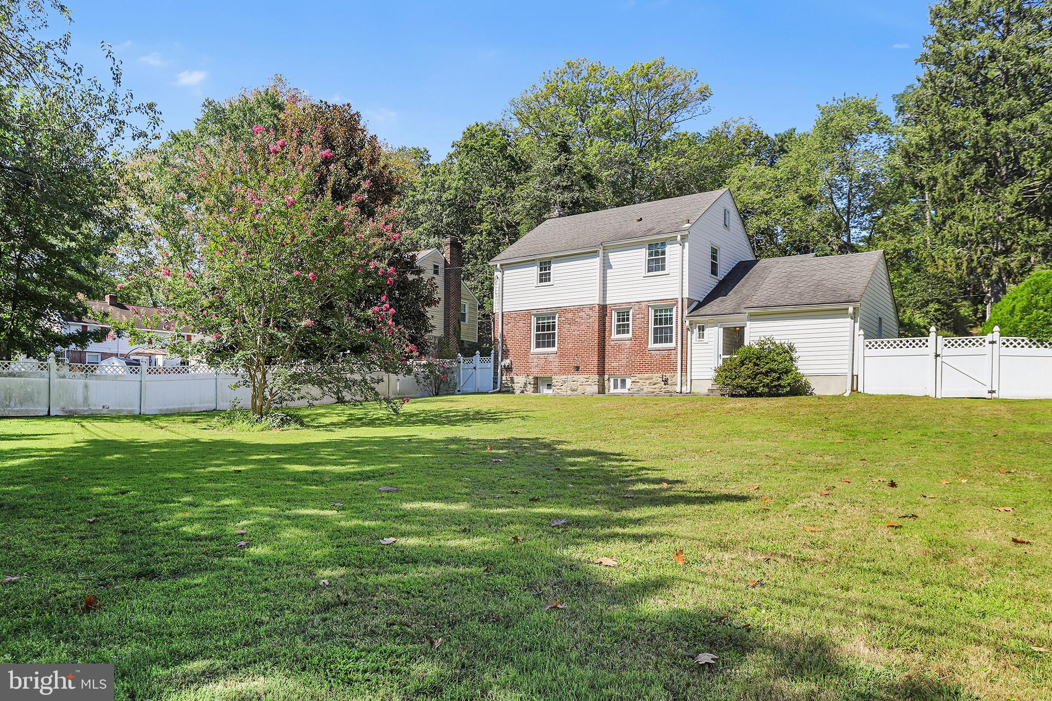 53 North Hillcrest Road Springfield, PA 19064 - Photo 23 of 23 a view of a big house with a big yard and large trees