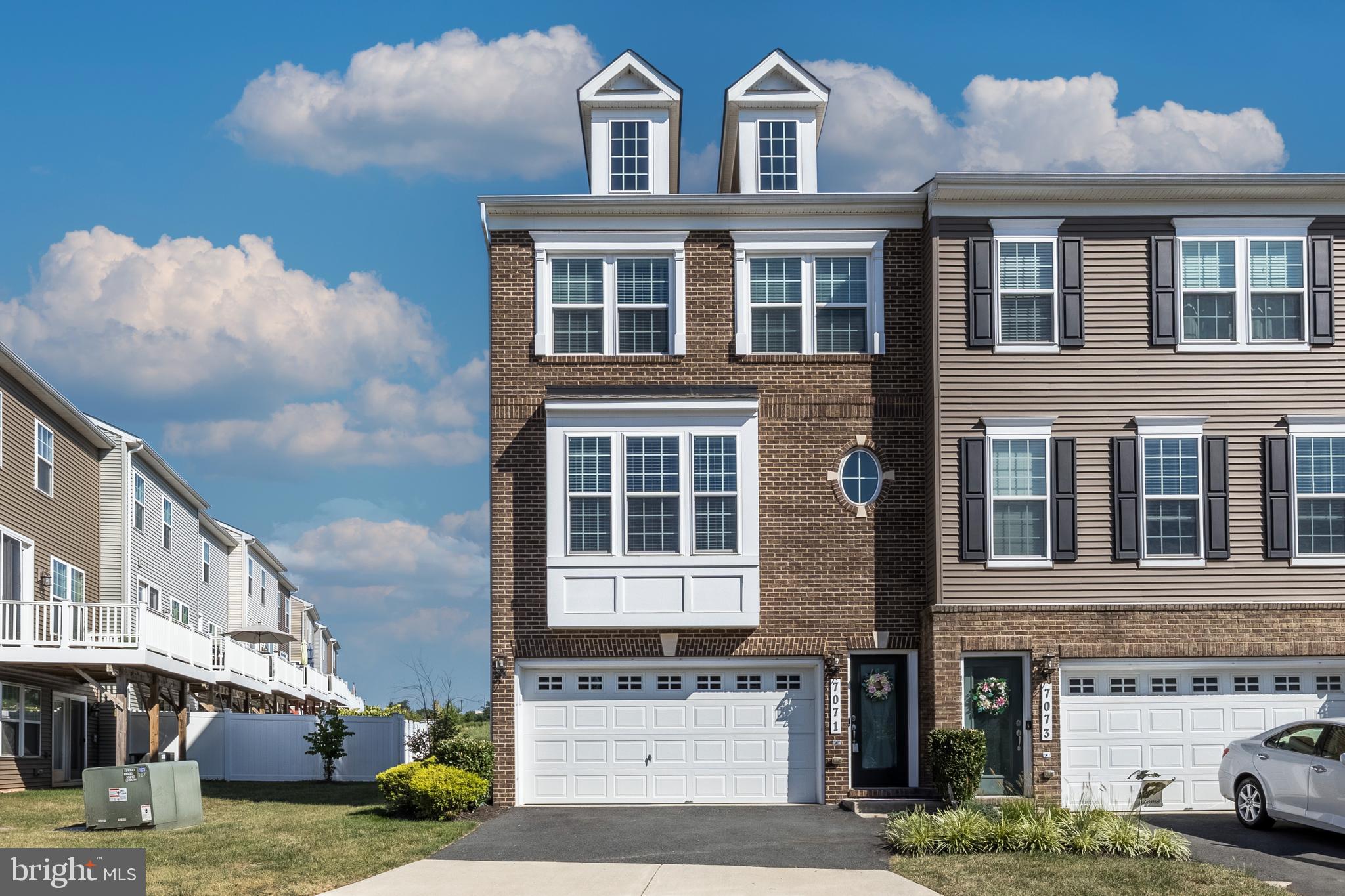 7071 Mongoose Trail Gainesville, VA 20155 - Photo 1 of 51 a front view of a building with balcony