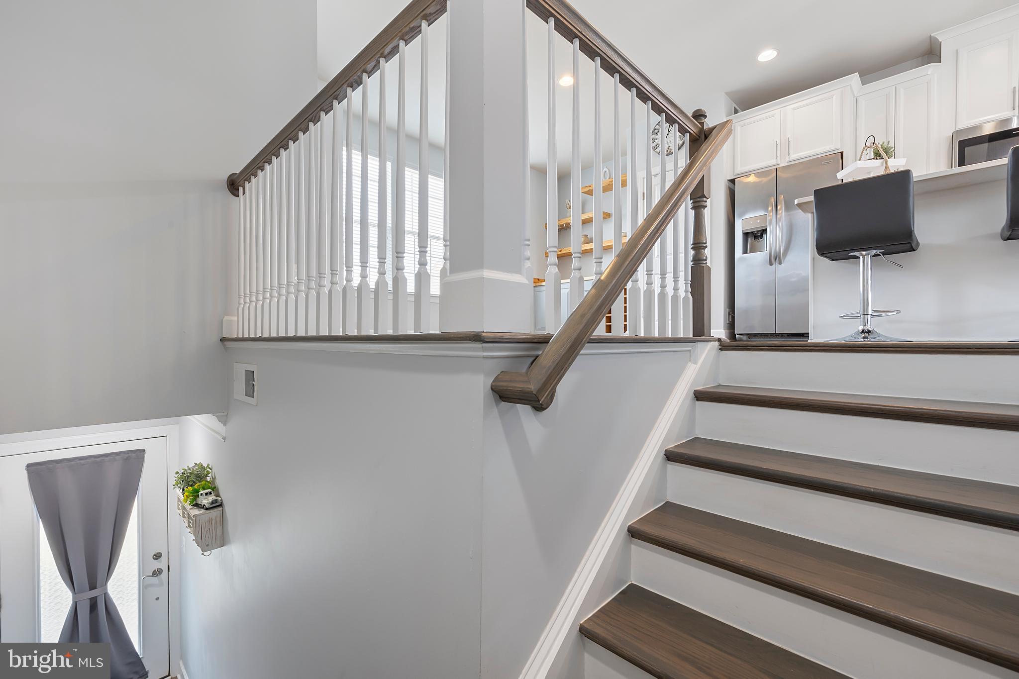 7071 Mongoose Trail Gainesville, VA 20155 - Photo 11 of 51 a view of entryway and hall with wooden floor
