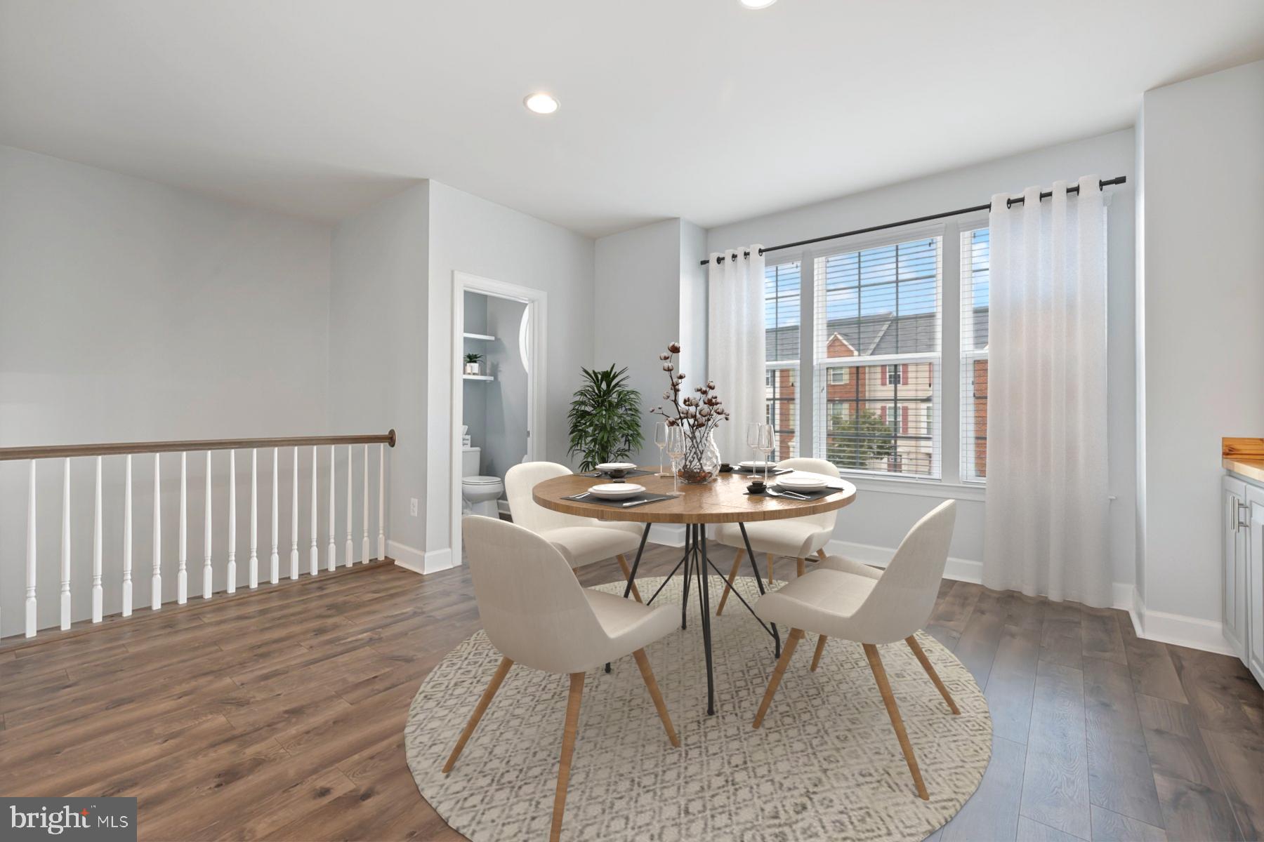 7071 Mongoose Trail Gainesville, VA 20155 - Photo 14 of 51 a view of a dining room with furniture window and wooden floor