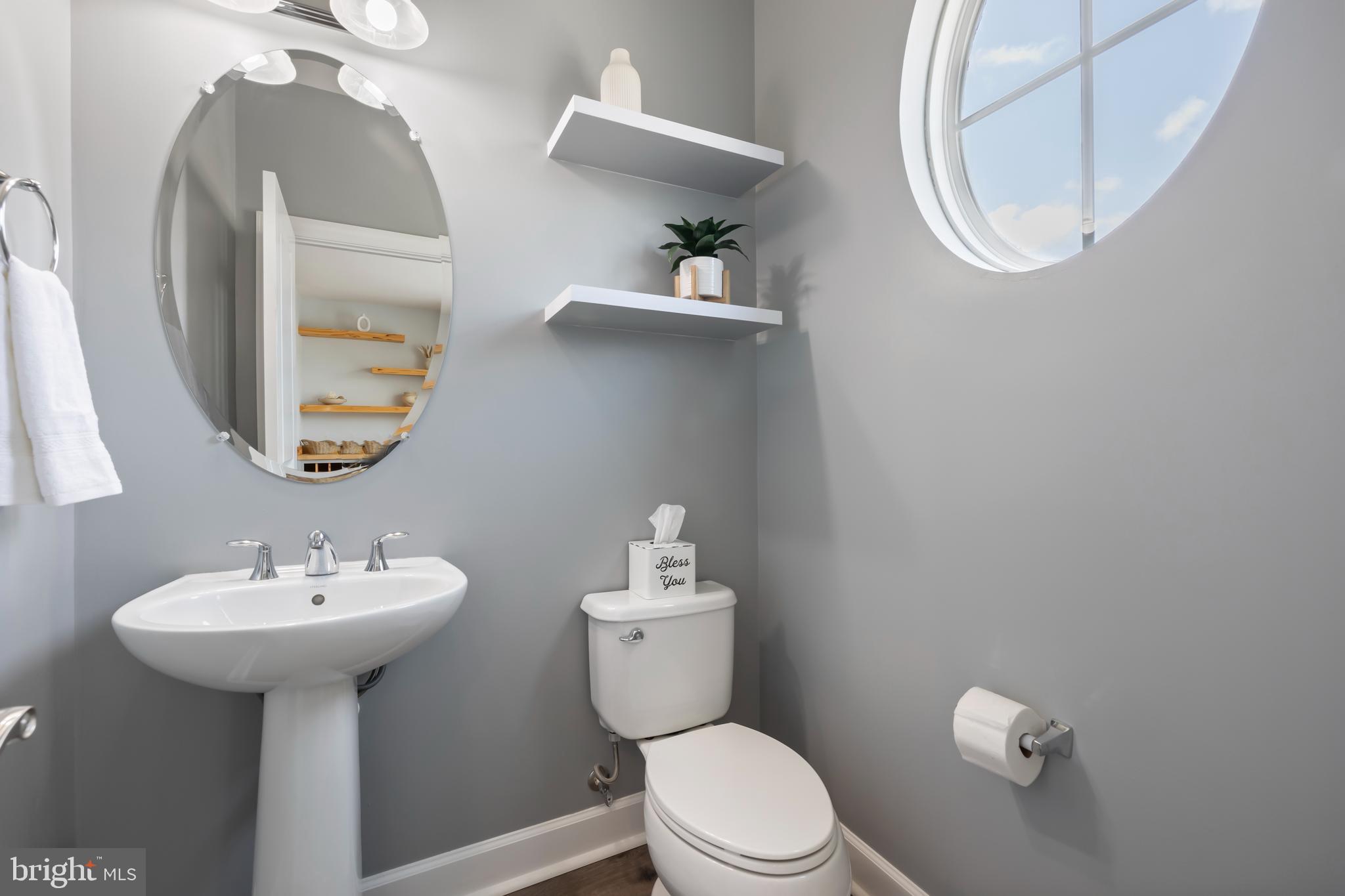 7071 Mongoose Trail Gainesville, VA 20155 - Photo 22 of 51 a bathroom with a sink mirror and toilet