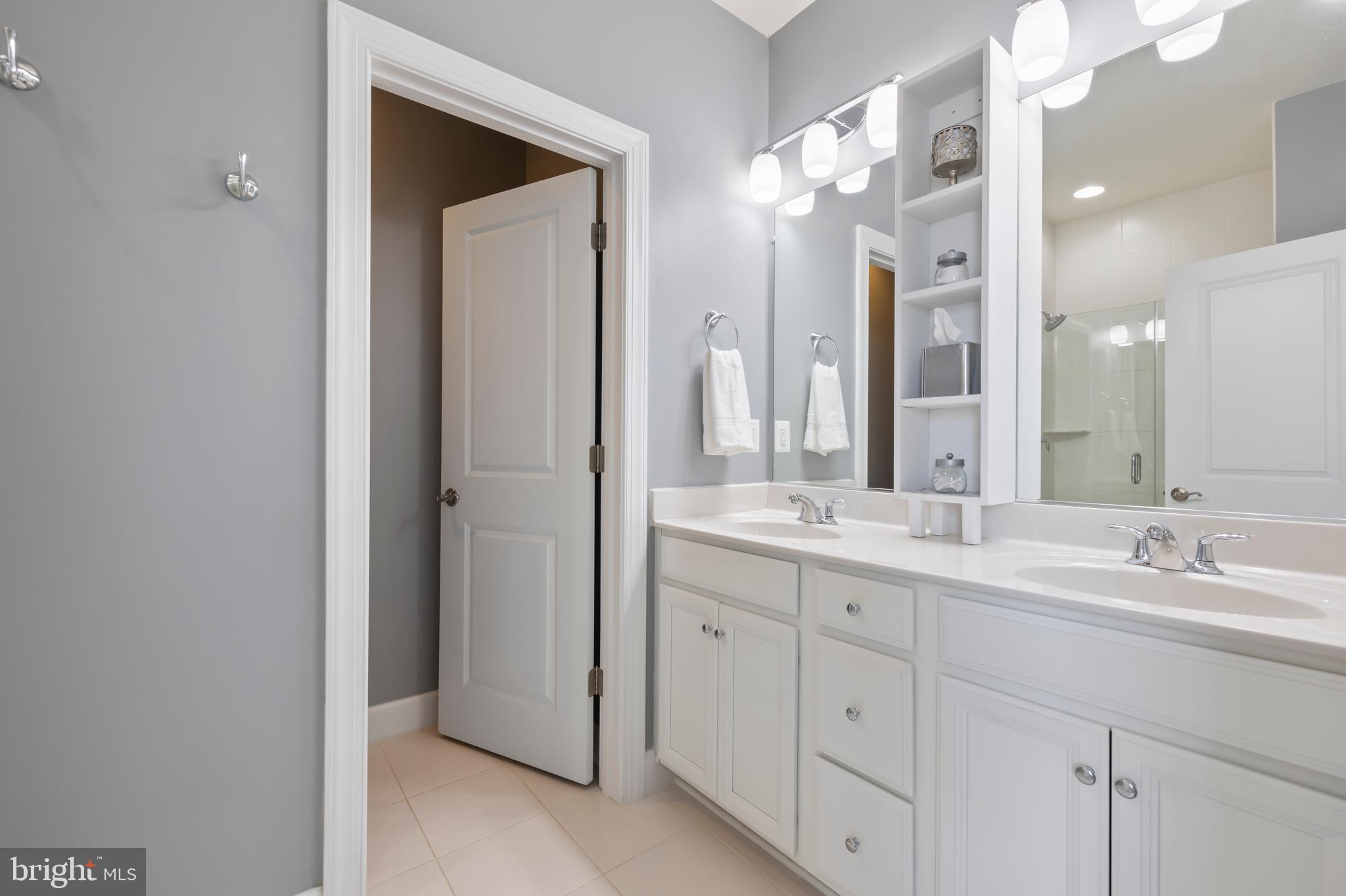 7071 Mongoose Trail Gainesville, VA 20155 - Photo 34 of 51 a bathroom with a granite countertop sink double and mirror
