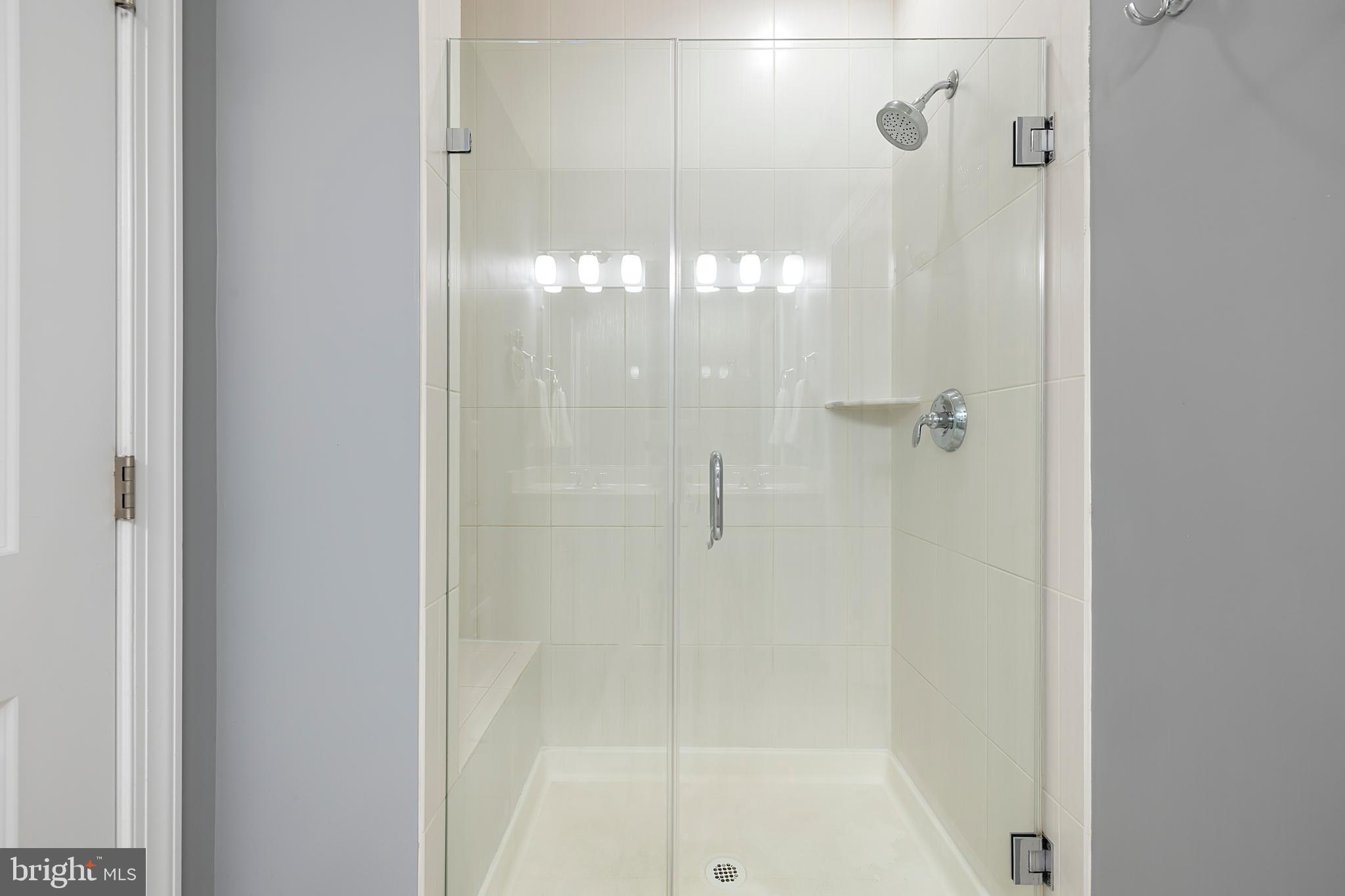 7071 Mongoose Trail Gainesville, VA 20155 - Photo 35 of 51 a bathroom with a glass shower door