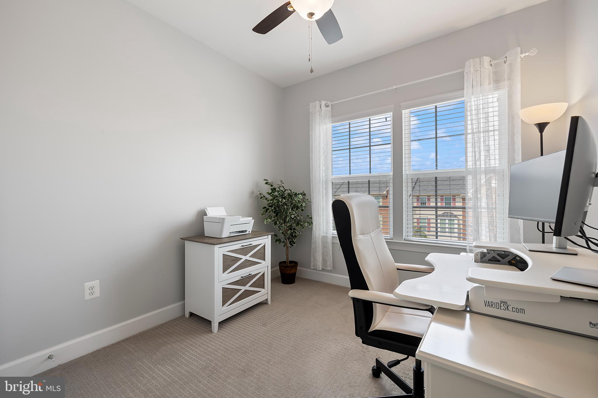 7071 Mongoose Trail Gainesville, VA 20155 - Photo 38 of 51 a view of a workspace with furniture and a window