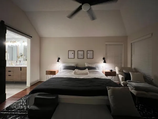 a bedroom with bed and window