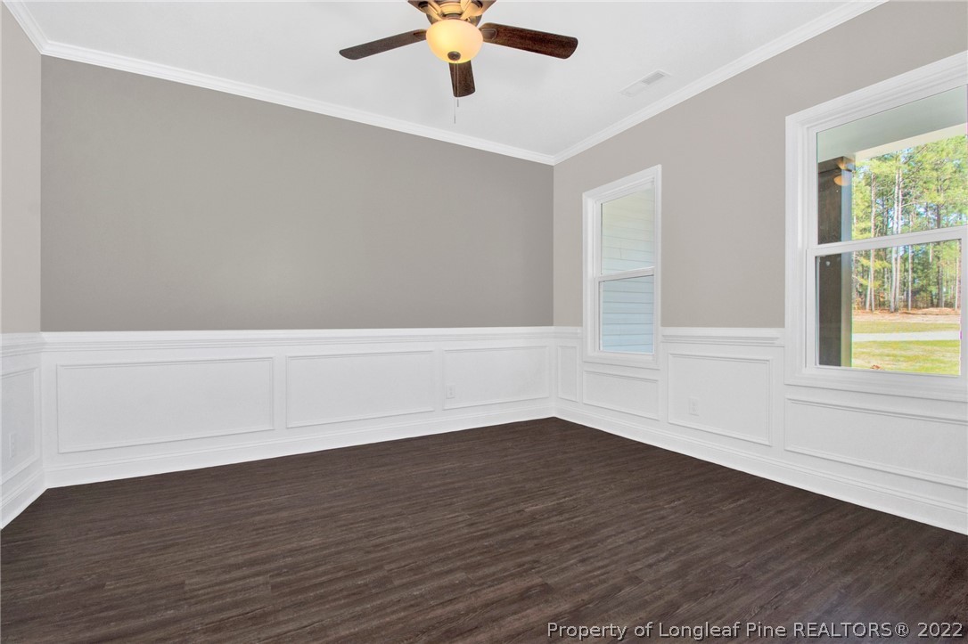 520 Pendergrass Road Raeford, NC 28376 - Photo 5 of 37 an empty room with wooden floor and windows
