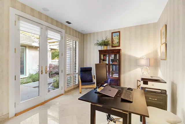 a workspace with furniture and window