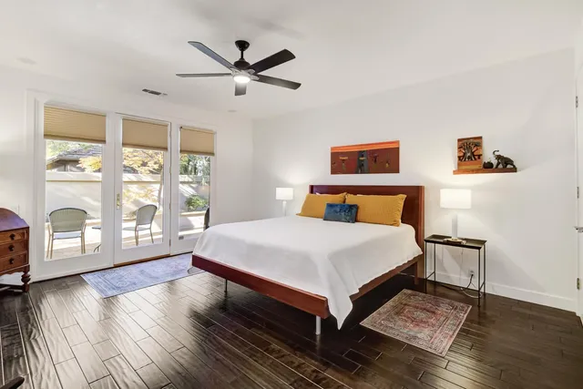 a bedroom with a large bed and a window