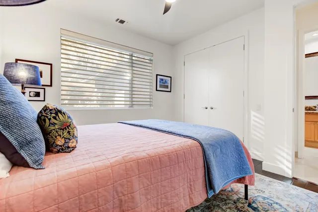 a bedroom with a bed and a tv