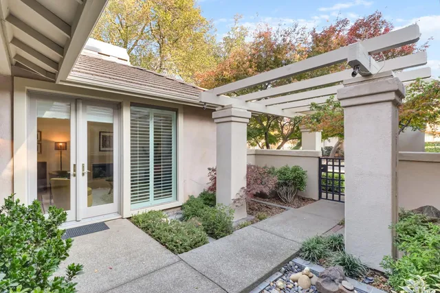 a front view of a house with a garden