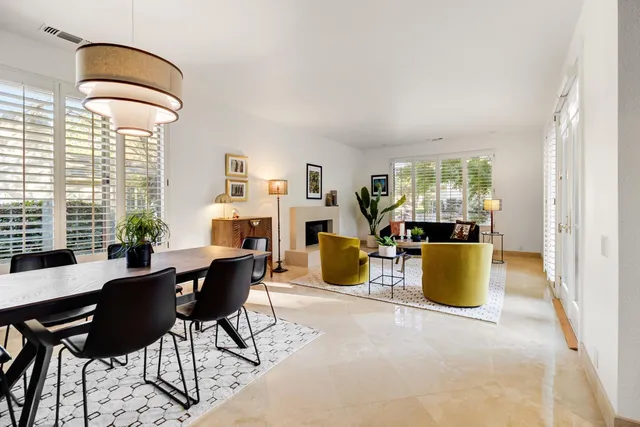 a view of a dining room with furniture and a window