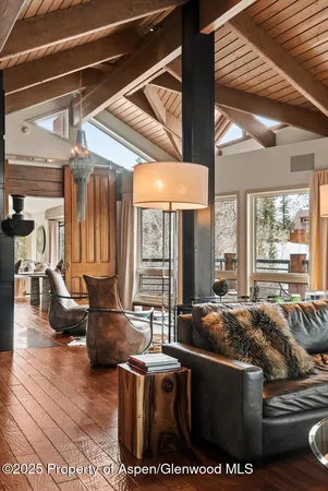 a living room with furniture window and wooden floor