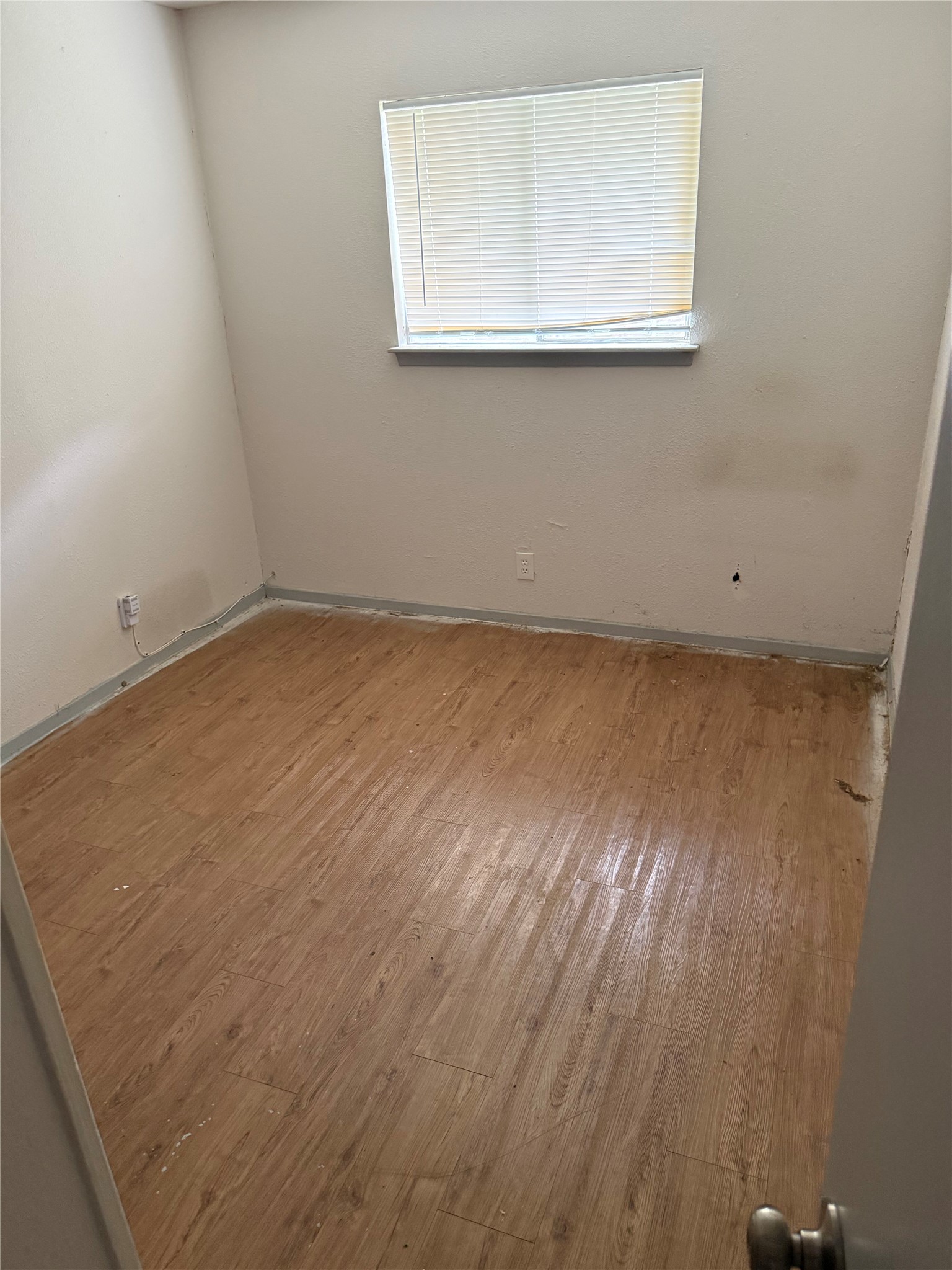 1303 Falcon Cove Austin, TX 78745 - Photo 11 of 16 a view of a small space with wooden floor and a window