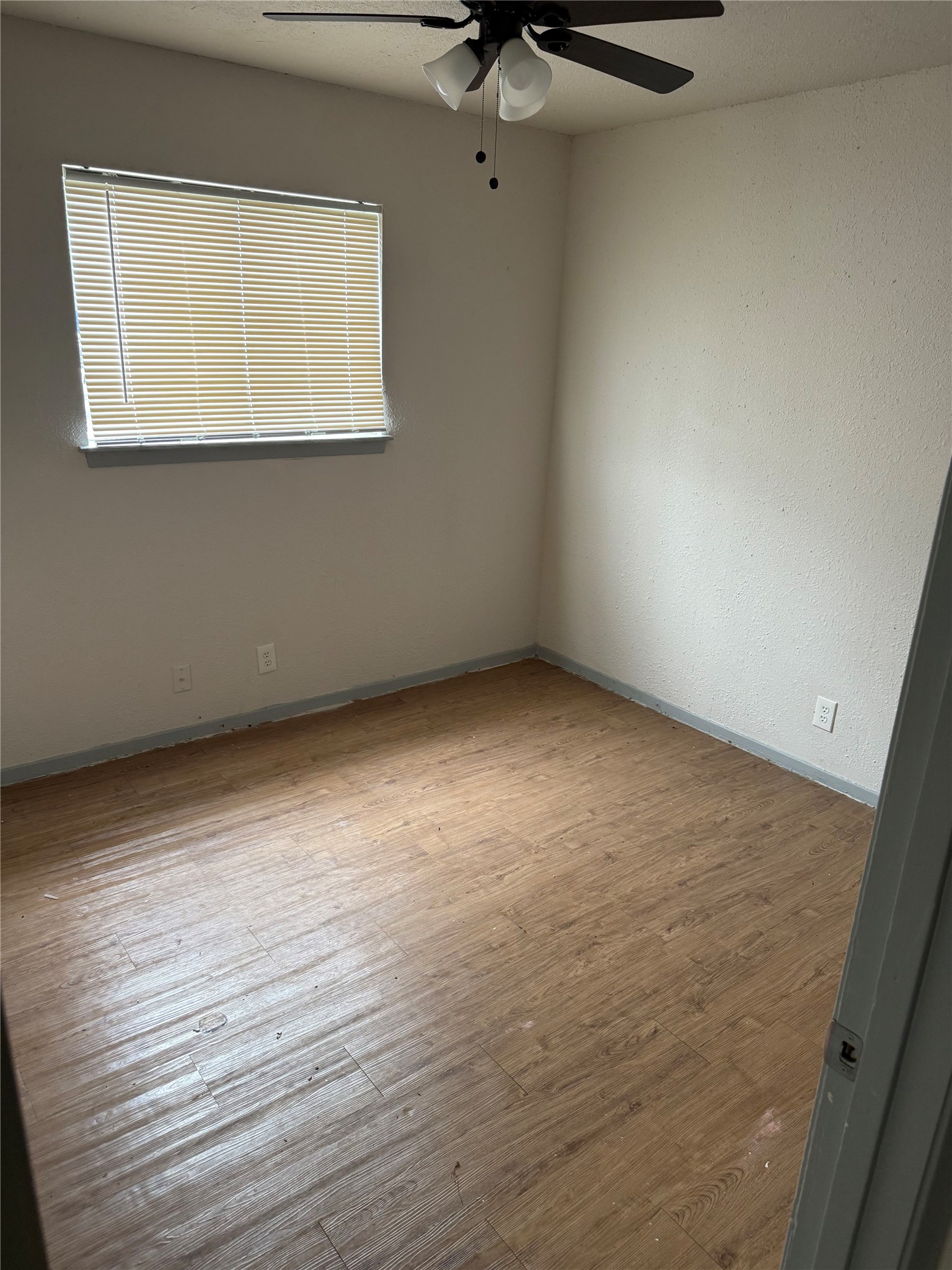 1303 Falcon Cove Austin, TX 78745 - Photo 10 of 16 a view of an empty room with a window
